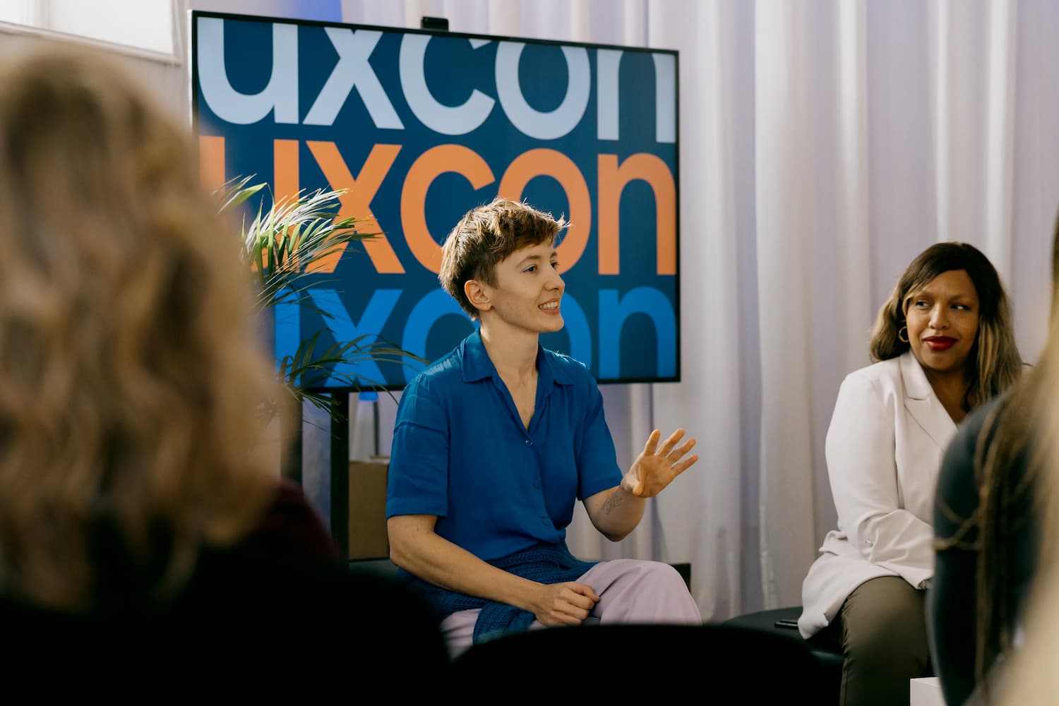 Mina is discussion UX at a panel discussion at uxCon Vienna 2025.